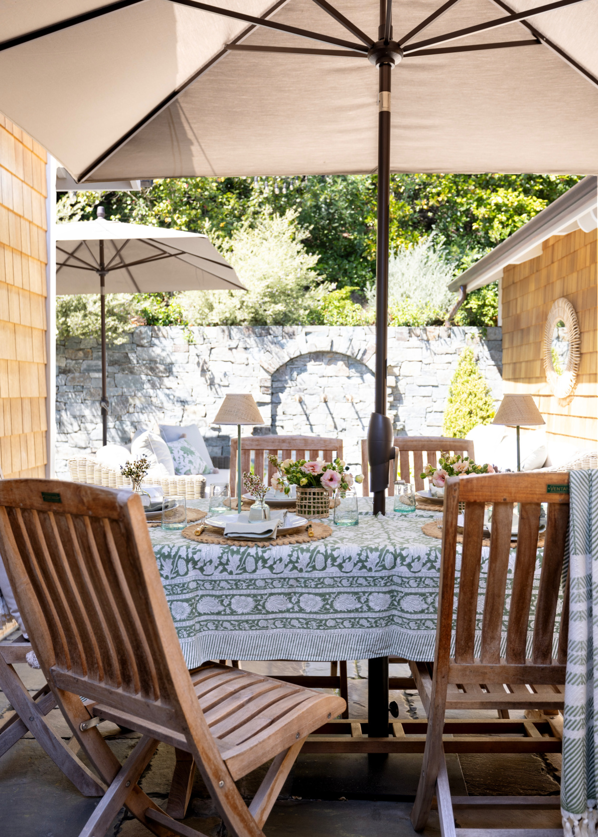 Outdoor table setting in green and white.